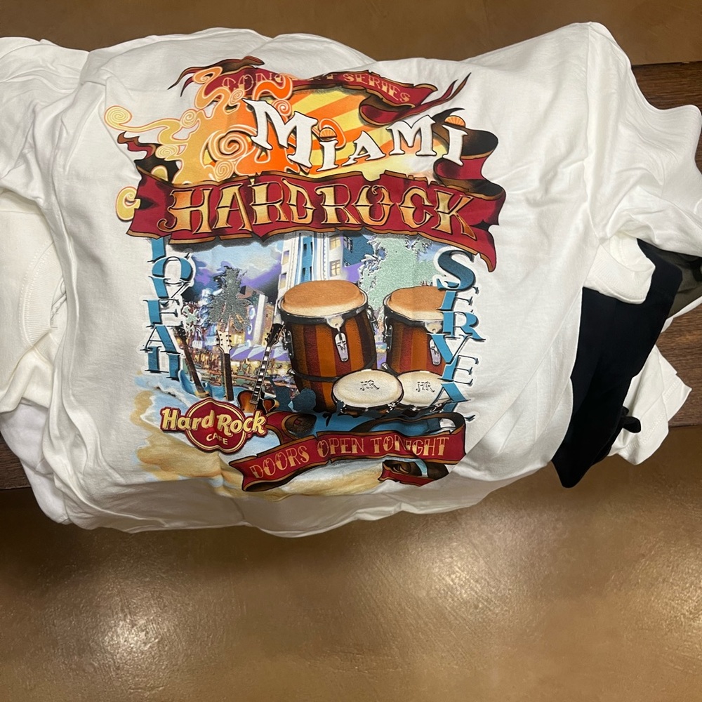 56 Hard Rock Cafe T-Shirts. NWT. They all have tags and labels of authenticity.